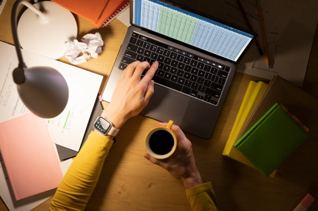 hands working at a well-organized desk