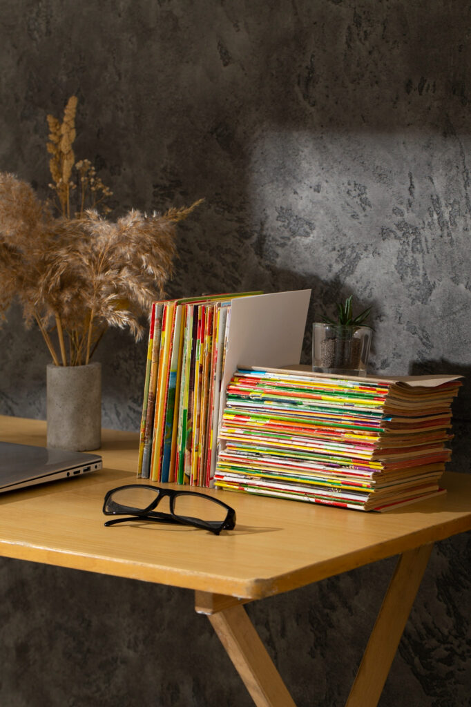 neatly arranged documents on marble shelf minimal.